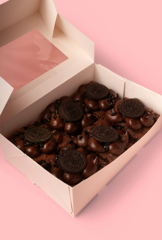 Box of chocolates on a pink background