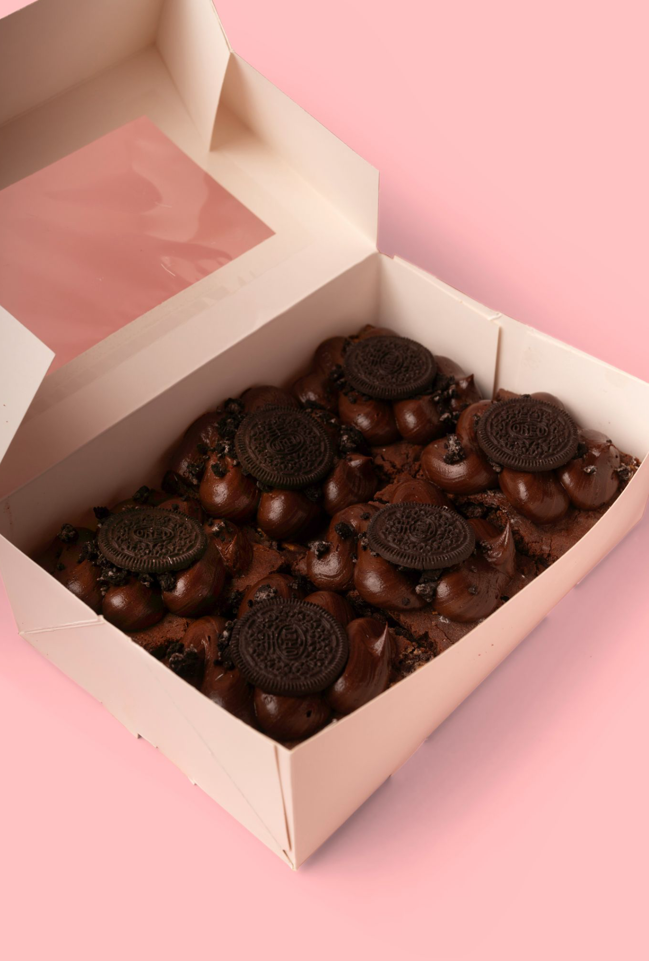 Box of chocolates on a pink background